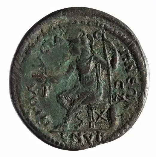 Moneta provinciale in bronzo, Rovescio Dea Roma elmata e seduta, zecca di Smirne, 214-215 d.C.